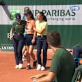 The chair umpire had to intervene as the ball girl was helped off court.