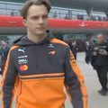 Oscar Piastri walks around the Chinese Grand Prix venue after he was withdrawn late.