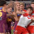 Players from both teams get into a scuffle as tempers flare after Brisbane kick another goal to move further ahead.