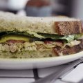 Coriander aioli and pickled zucchini liven up the club sandwich.