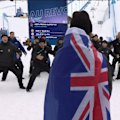 Luca Harrington's New Zealand teammates perform a haka after he clinched bronze in the freeski slopestyle final.
