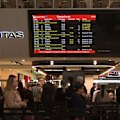 Melbourne's bitter cold snap is causing havoc, with high winds and heavy rain battering the city and causing dozens of flight cancellations.