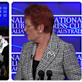 A protest banner was unfurled behind One Nation leader Pauline Hanson as she spoke to the National Press Club.