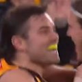 Nick Watson goes at Bulldog Michael Sellwood after kicking a goal.