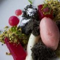 Poached watermelon, black sesame cake, pistachio crumbs, and yoghurt jelly.