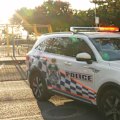 Police are negotiating with a man who climbed halfway up a construction crane in Miami on the Gold Coast.