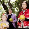 Anita Jack and Tim Baxter with their children Stellina Baxter 11 and Amelita Baxter 5, and Anita's father Russell Jack underneath a 100 year old Pomelo tree at the Golden Dragon Chinese Museum in Bendigo, which is believed to be the first and the mother of all others in Australia.