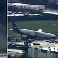 An Amazon cargo plane barrelled off a runway at Miami International Airport, striking vehicles, bursting into flames and sending thick black smoke into the sky.