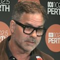 A Perth doctor has been honoured for his bravery after taking on a man with an axe as he attacked a colleague.