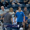 A heckler in the crowd is removed from the grandstand after yelling down at Jakub Mensik during his match. 