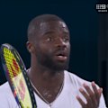 Frances Tiafoe reacts with disappointment after the umpire called let.