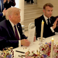The president signs the agreement with Iran ending the war at the meeting of world leaders in France.