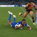 Jethro Rinakama powers over the tryline in the first minute of the Bulldogs' clash against the Tigers.