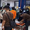 Dozens of rescued survivors from overturned ferry brought to Indonesian port