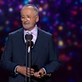 Andrew Denton accepts the Logie Awards Hall of Fame statue.