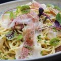 Pasta carbonara and roasted brussels sprouts with smoked almond cream.