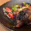 Jumbo quail stuffed with black rice and lap cheong.