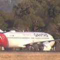 A Qantas flight from Melbourne to Adelaide was forced to divert to an RAAF base in South Australia overnight due to high winds.