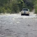 Flood warnings continue in Queensland as heavy rain lashes coastal regions.