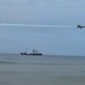 A low-flying jet from an elite US Navy unit has caused chaos on a Florida beach.