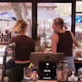 An Adelaide cafe owner who has welcomed dogs inside her establishment for years has been forced to ban four-legged friends following a council order.