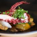 Go-to dish: Grilled octopus with tomatoes, potato and olives.