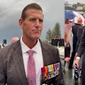 Accused war criminal Ben Roberts-Smith attended a beachside dawn service on the southern Gold Coast, adorned in medals received for his service in Afghanistan.