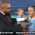 Millie Elliott's daughter Gigi keeps Sam Thaiday on his toes post-match.