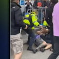 Six people have been charged after two police officers were attacked during the grand final watch party on the 