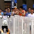 Chinese-made humanoid robots whizzed past ​human runners in Beijing on Sunday.