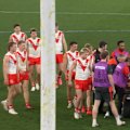 Sydney Swans player Will Edwards is stretchered from the field after a significant leg injury.