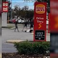 The footage, shared to social media, appears to show a man confronting a group of children in a car park.