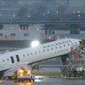An investigation is underway into a deadly collision between a plane and fire truck at New York's LaGuardia airport.