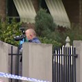 A man is in hospital under police guard after a  young mother was stabbed to death at a home in Melbourne’s east.