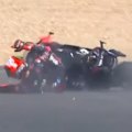 MotoGP championship leader Marco Bezzecchi twice slaps a marshal in the face after crashing his bike.