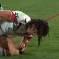 Dallin Watene-Zelezniak injures his shoulder when diving out to score a try for the Warriors.