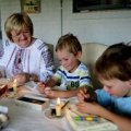 FOOD AND WINE: Irena Schorsch of Evatt with her grandchildren L-R Hayden Schorsch,3 of Dunlop, Brodie Schorsch and Christian Korodaji,5  painting decorative eggs  as this is the tradition in the Ukraine. 17th April 2013. Photo by MELISSA ADAMS of The Canberra Times..