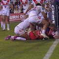 Tom Flegler crashes over the tryline to score for the Dolphins.
