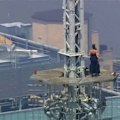 Two Russian daredevils have been arrested after climbing to the top of the Empire State Building in New York City.