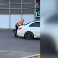The owner of a car workshop has clung to the boot of a moving Mercedes-Benz during a heated confrontation in a shopping centre car park in Melbourne’s south-east.