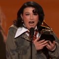 Appearing overwhelmed, Lola Young makes an emotional thank you speech after winning a Grammy.
