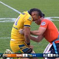 Parramatta back-rower Kelma Tuilagi stays down and clutches at his ribs.