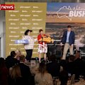 Billionaire Gina Rinehart gives One Nation leader Pauline Hanson a toy bulldozer at News Corp's summit in Townsville.