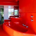 Take a guided tour of this Castlecrag home including its red fibreglass bathroom that’s been called “the most beautiful bathroom in the world”.