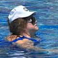 Pauline Hanson has been spotted poolside with her billionaire backer Gina Rhinehart in Italy.