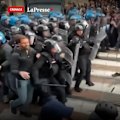 Police charge against demonstrators in the city's Piazza Castello on Saturday as other protests took place across Italy.