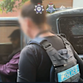 A Melbourne man has been charged with being an Islamic State propagandist, accused of instructing others how to carry out mass casualty attacks.