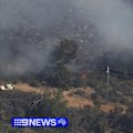 Authorities believe the Perth Hills bushfire, which is close to homes and caused airport chaos, was deliberately lit.