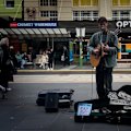 How do you make money busking during a cost-of-living crisis when spare change is scarce?