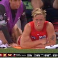 Isaac Heeney receives treatment for a hamstring injury.